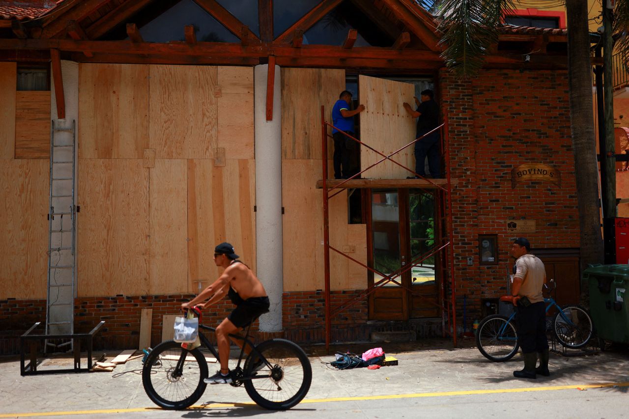 People board-up a window before the arrival of Hurricane Beryl, in Playa del Carmen, Mexico, on July 4.