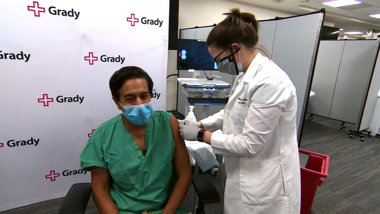 Dr. Sanjay Gupta receives a Covid-19 vaccine shot.