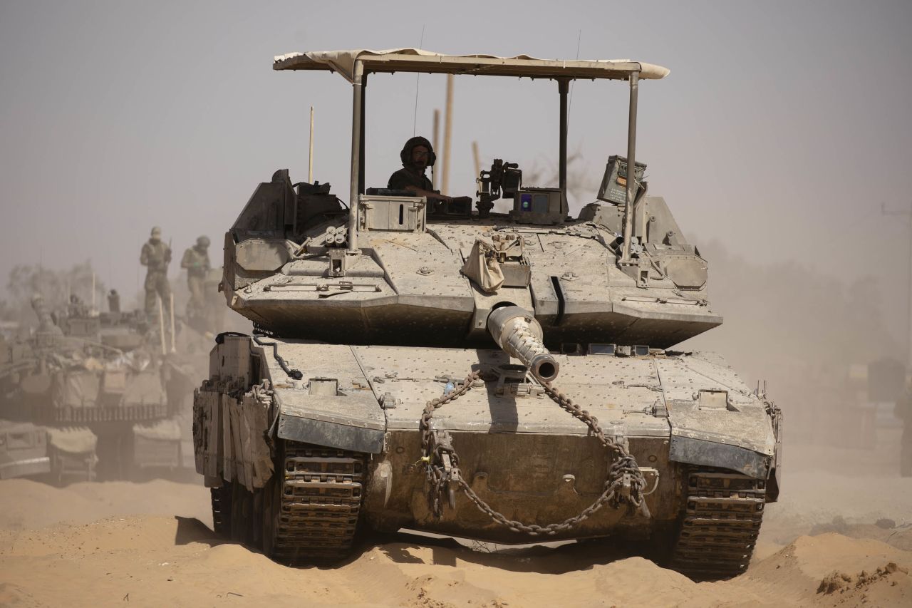 An Israeli soldier stands on a tank near the border with southern Gaza on May 5. 