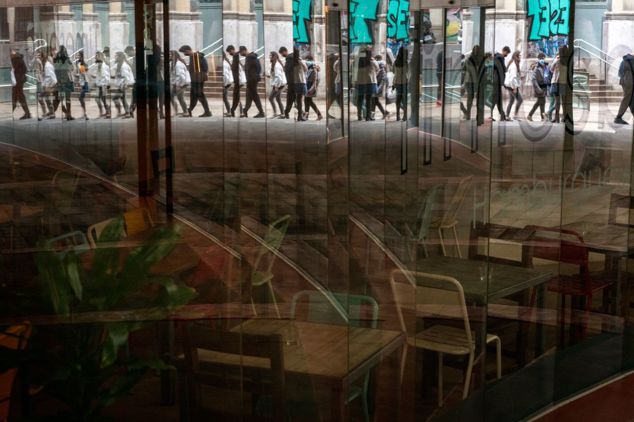 People walk past a restaurant closed due to sharpest resurgences of the new coronavirus in Barcelona, Spain on October 22.