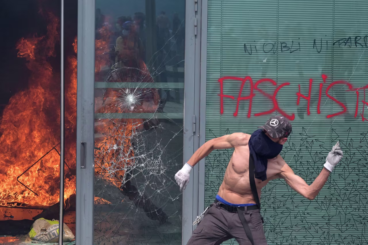 A protester clashes with police during a march on Thursday in Nanterre.