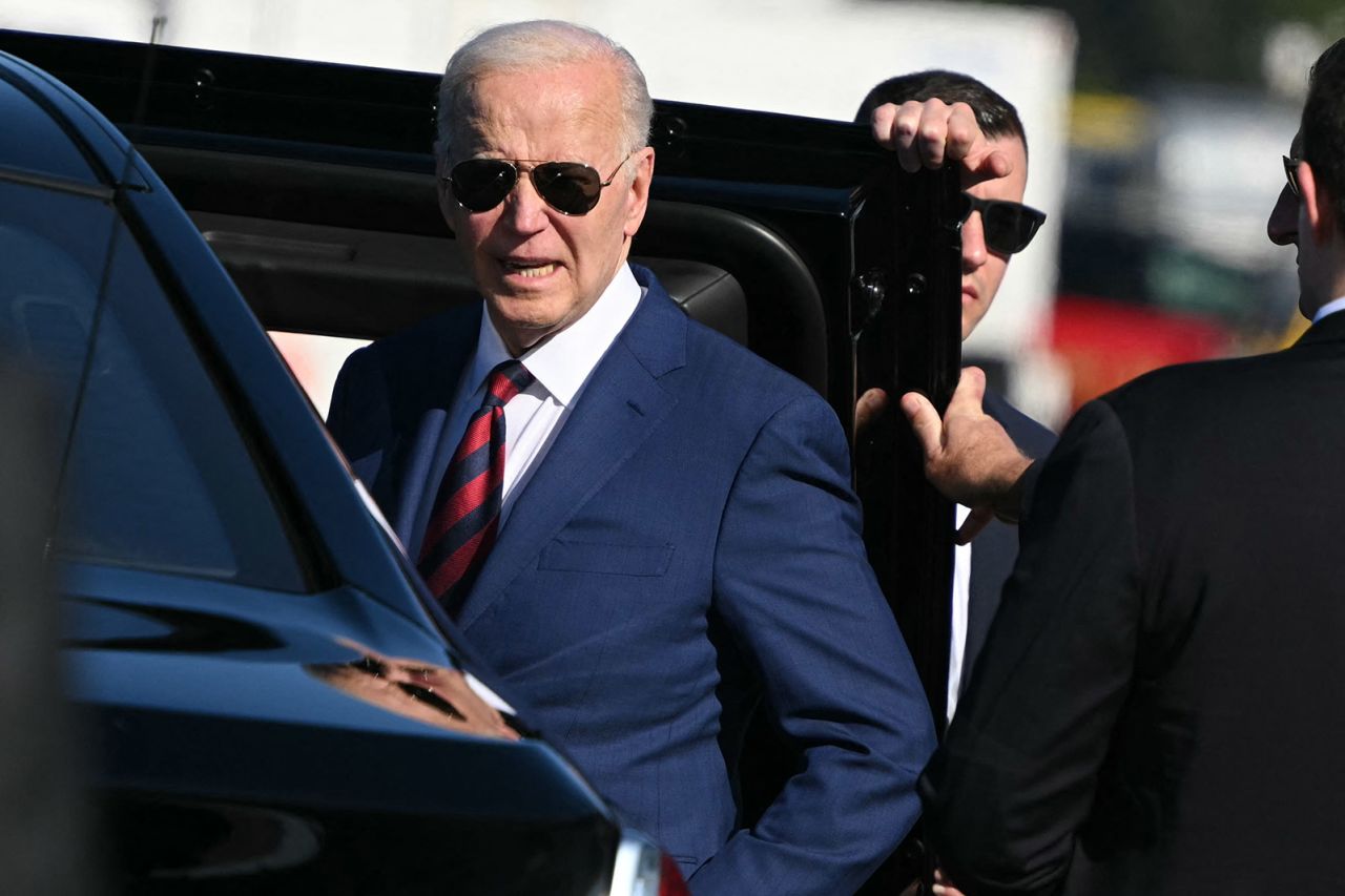 US President Joe Biden listens to a question from reporters before getting into a car upon arrival at Seattle-Tacoma International Airport, in SeaTac, Washington, on May 10.