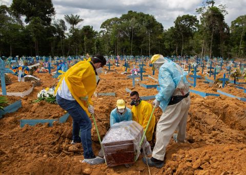 A burial takes place in an area reserved for COVID-19 victims at the Nossa Senhora Aparecida cemetery in Manaus, Brazil, on January 5. 