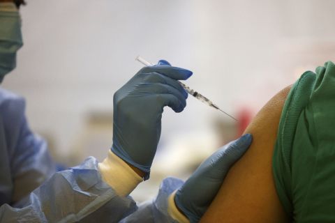 A health care worker administers a Covid-19 vaccine in the Bronx, New York, on February 5.