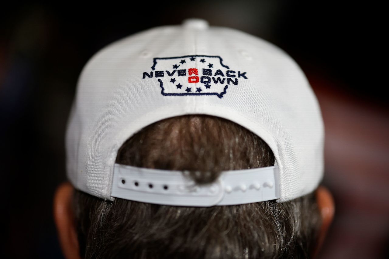 A Ron DeSantis supporter listens as the Republican presidential candidate speaks on Sunday in Cedar Rapids, Iowa.