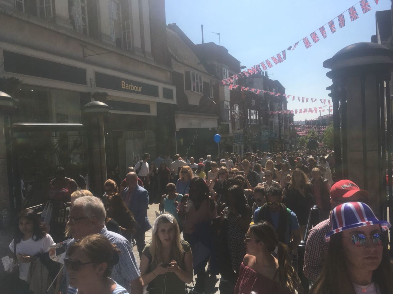 The High Street in Windsor packed with crowds post-ceremony.	
