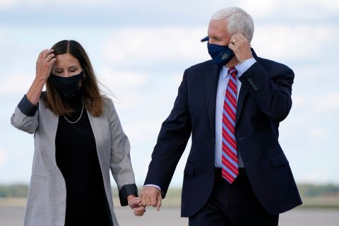 Vice President Mike Pence holds hands with Karen Pence at Andrews Air Force Base, Maryland, on October 5.