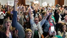 People cheer as they watch election results come in on November 7, in Columbus, Ohio. 