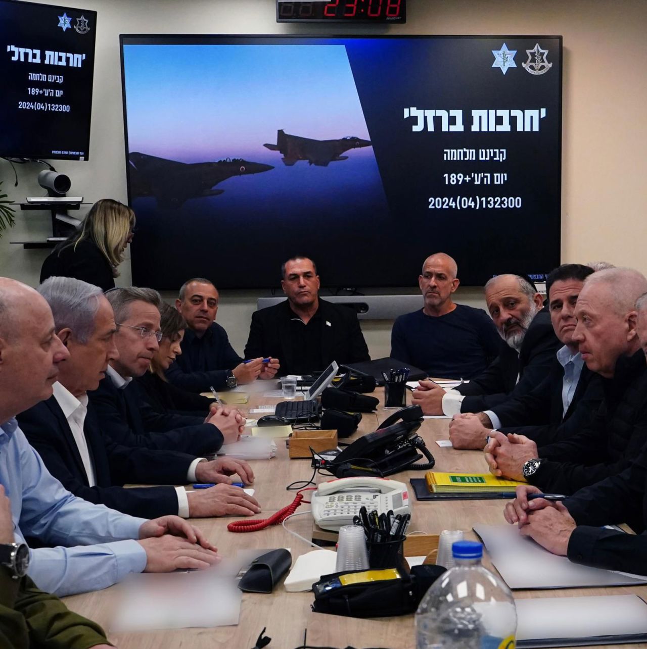 This handout photo, released early Sunday local time, shows Israeli Prime Minister Benjamin Netanyahu, second from left, as he meets with members of his war cabinet at the Ministry of Defense in Tel Aviv, Israel. Portions of this photo have been blurred by the source. 