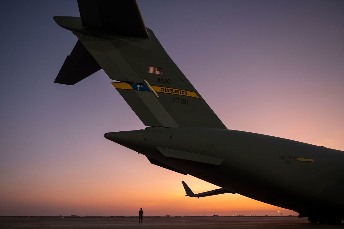 A US Air Force pilot conducts a pre-flight inspection on a C-17 Globemaster III at Al Udeid Air Base, Qatar, on June 29, 2023.