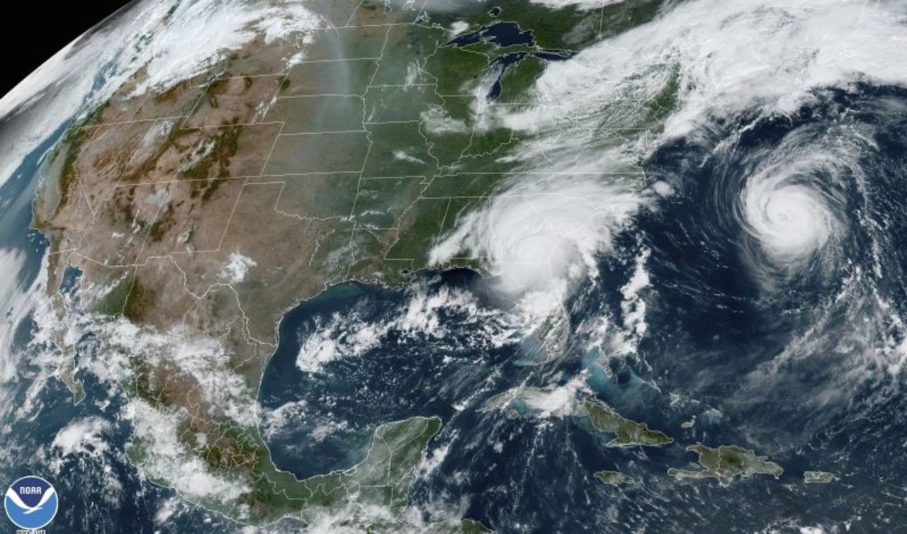 This satellite image from 11:21 a.m. ET shows Hurricane Idalia, center, over Florida and crossing into Georgia, and Hurricane Franklin, right, as it moves along off the East coast of the United States on August 30, 2023.