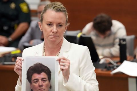Defense attorney Melisa McNeill holds a photograph of Nikolas Cruz's birth mother, Brenda Woodard, during her closing argument in the penalty phase on Tuesday.