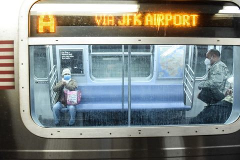 People ride the subway in New York City on May 6.
