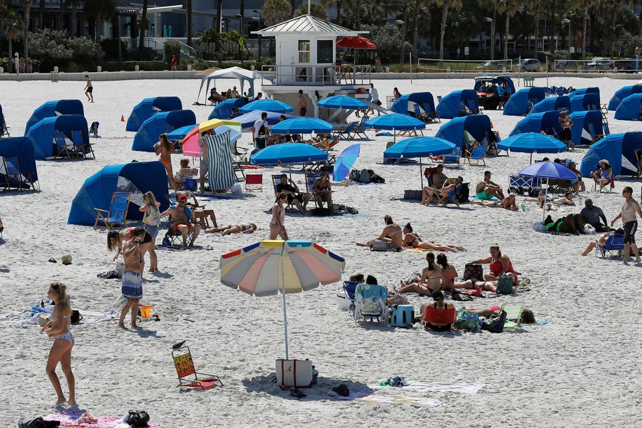 People visit a beach in Clearwater Beach, Florida, on March 18.