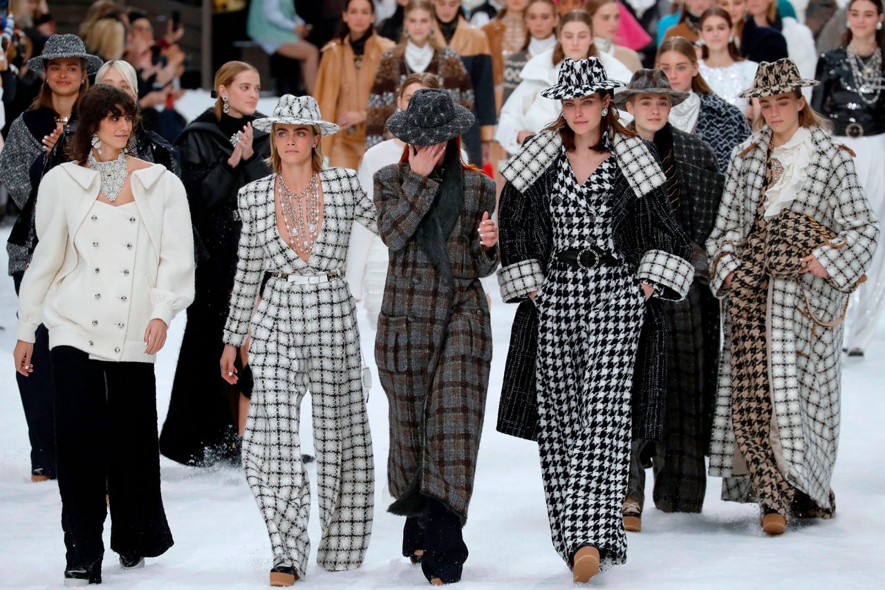 Models including Cara Delevingne (second from left) walk in the emotional finale of the Chanel Fall-Winter 2019 show during Paris Fashion Week on March 5, 2019.