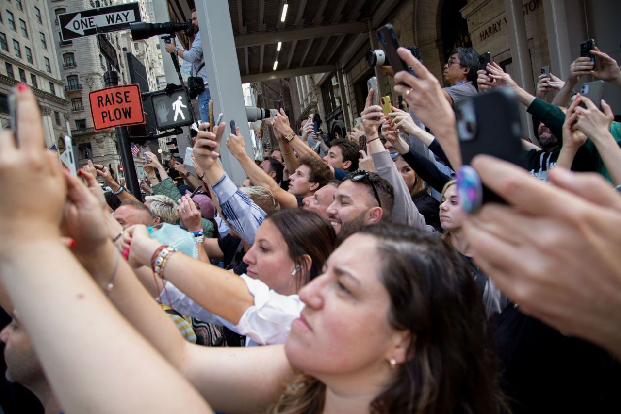 Bystanders try to catch a glimpse of Trump as he enters Trump Tower in New York after his conviction on May 30. 