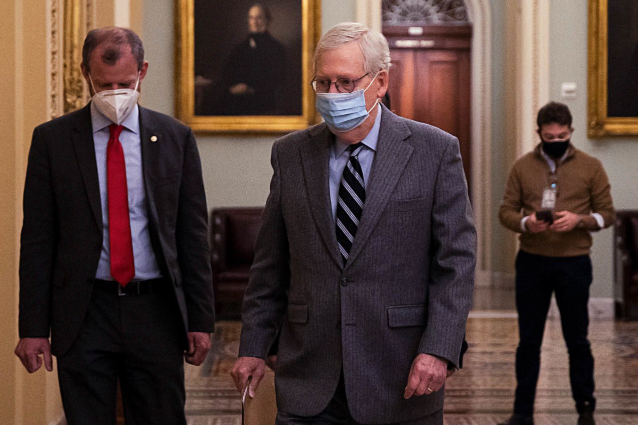 Senate Majority Leader Mitch McConnell walks to open up the Senate floor at the U.S. Capitol on December 16 in Washington, DC. 