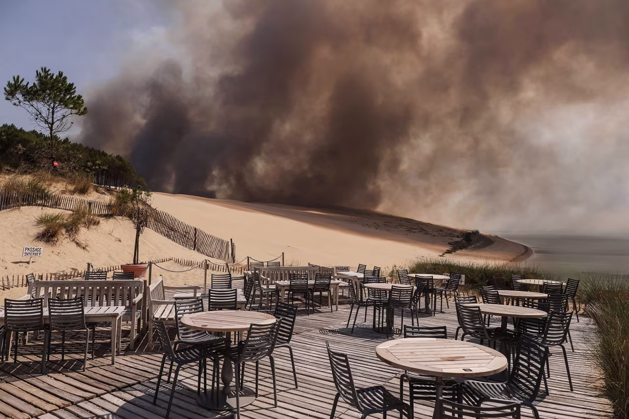 Smoke from a wildfire in La Test-de-Buch, France, rises over a beach on July 18.