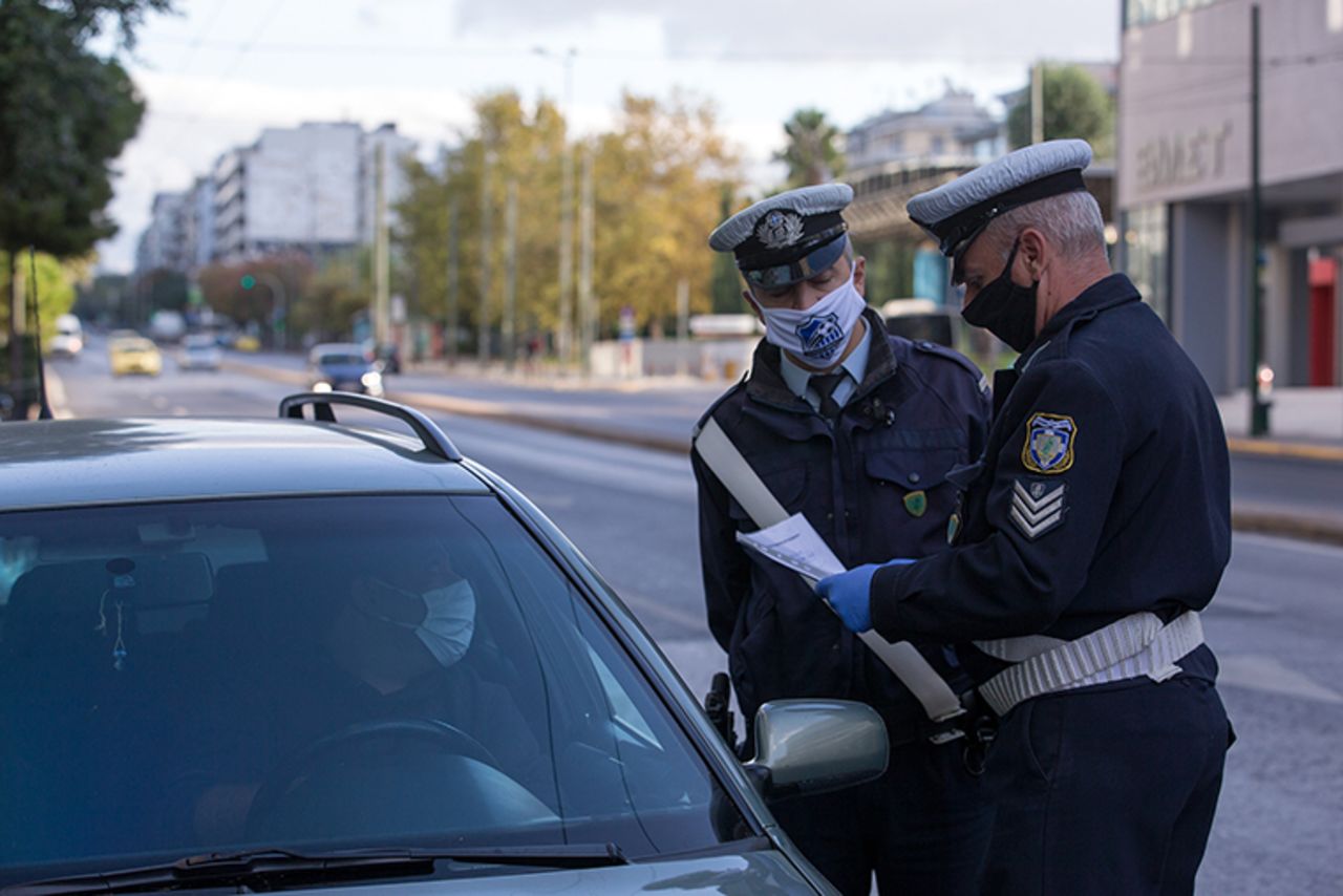 Policemen check on a driver for special permission to go outdoors in Athens, Greece, on November  7. 