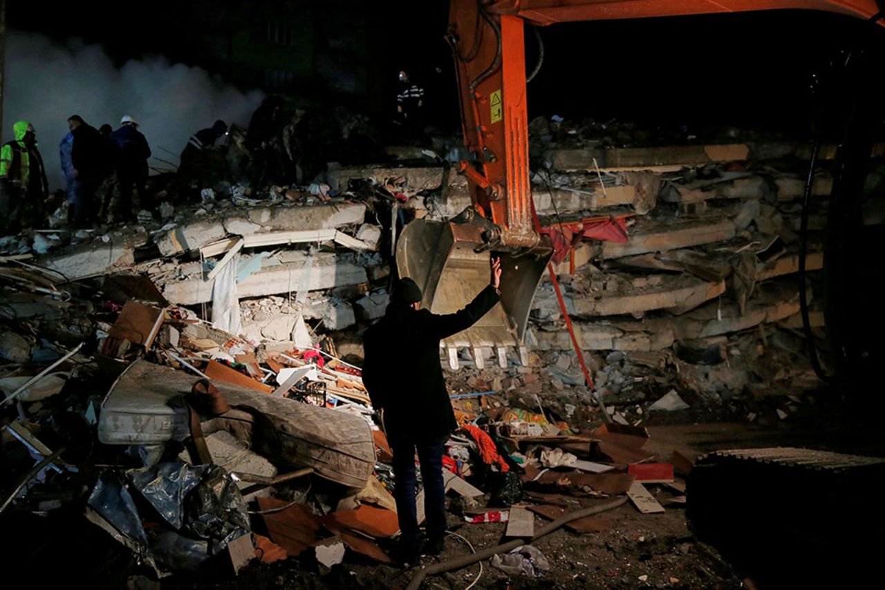 A rescue team works on a collapsed building in Osmaniye, Turkey.