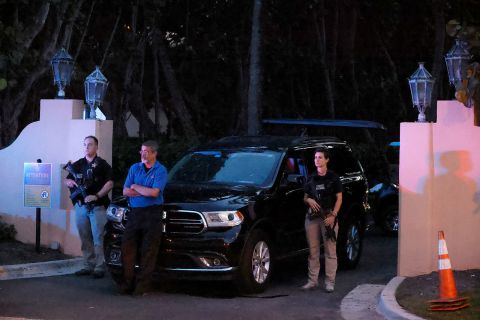The Secret Service stand outside an entrance to former President Donald Trump's Mar-a-Lago estate, on Monday, August 8, in Palm Beach, Florida. 