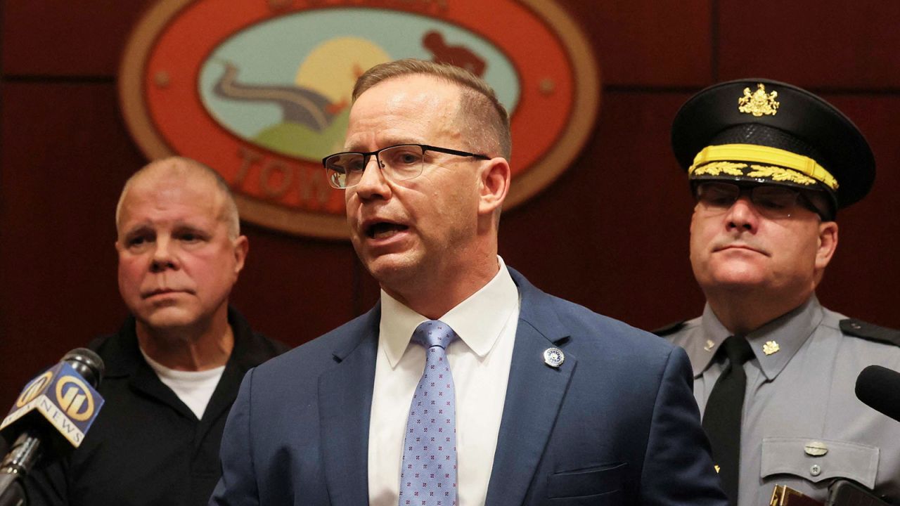 Kevin Rojek, special agent in charge of the FBI Pittsburgh field office speaks as Deputy Commissioner of Operations Lieutenant Colonel George Bivens and Pennsylvania State Police Colonel Christopher Paris look on, at a press conference at a police station in Butler, Pennsylvania, on July 13.