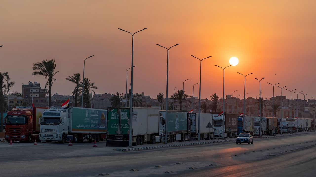 Aid convoy trucks loaded with supplies are seen waiting for the Gaza-Egypt border to open, in El-Arish, Egypt, on October 15. 