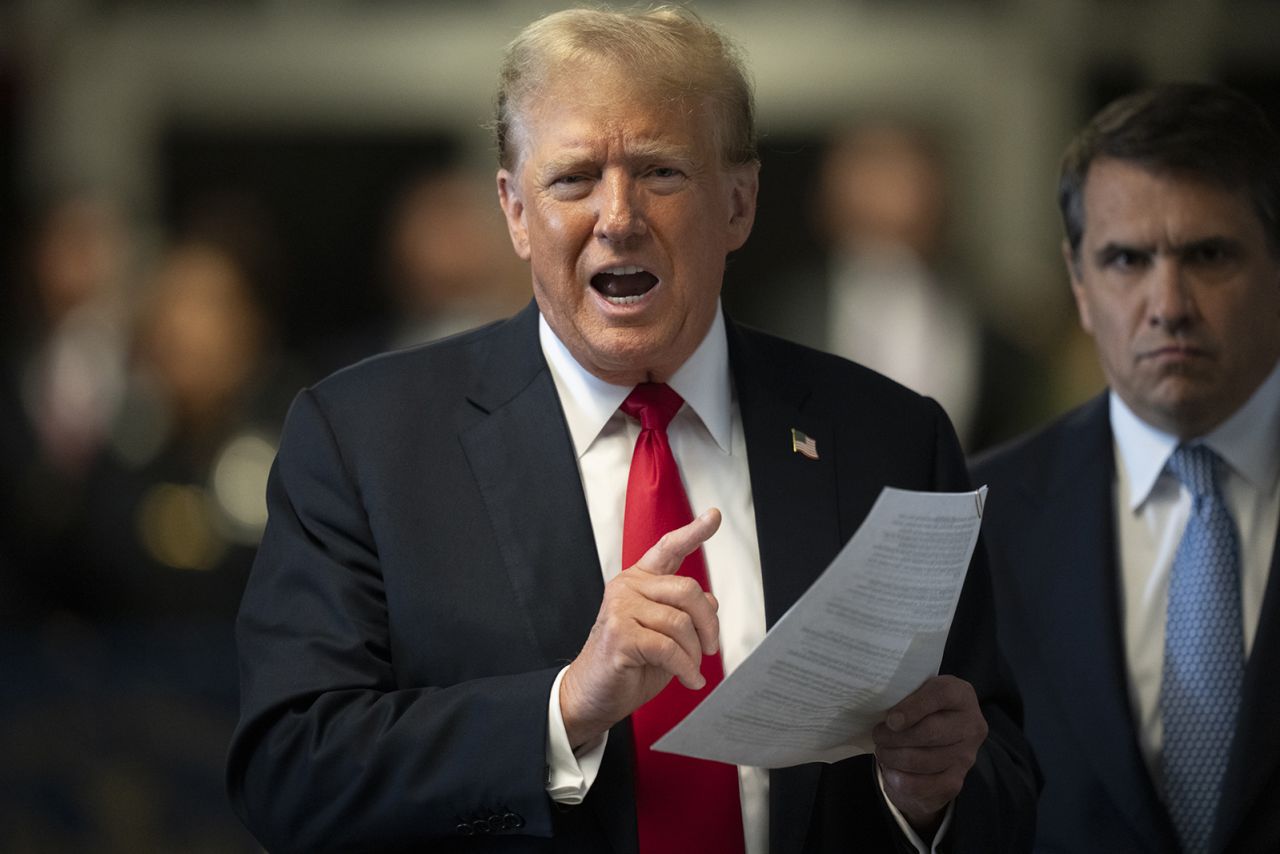 Former President Donald Trump speaks to the media as he arrives for his hush money trial at Manhattan Criminal Court on May 28.