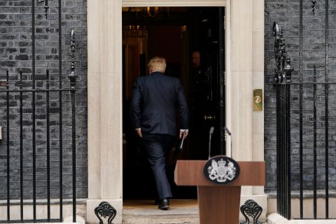 UK Prime Minister Boris Johnson enters 10 Downing Street after resigning from his position on Thursday.