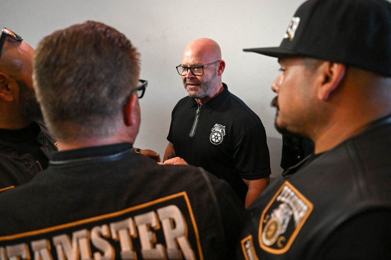 Teamsters General President Sean M. O'Brien shakes hands with workers during a rally with workers and union members in Long Beach, California, on August 29.