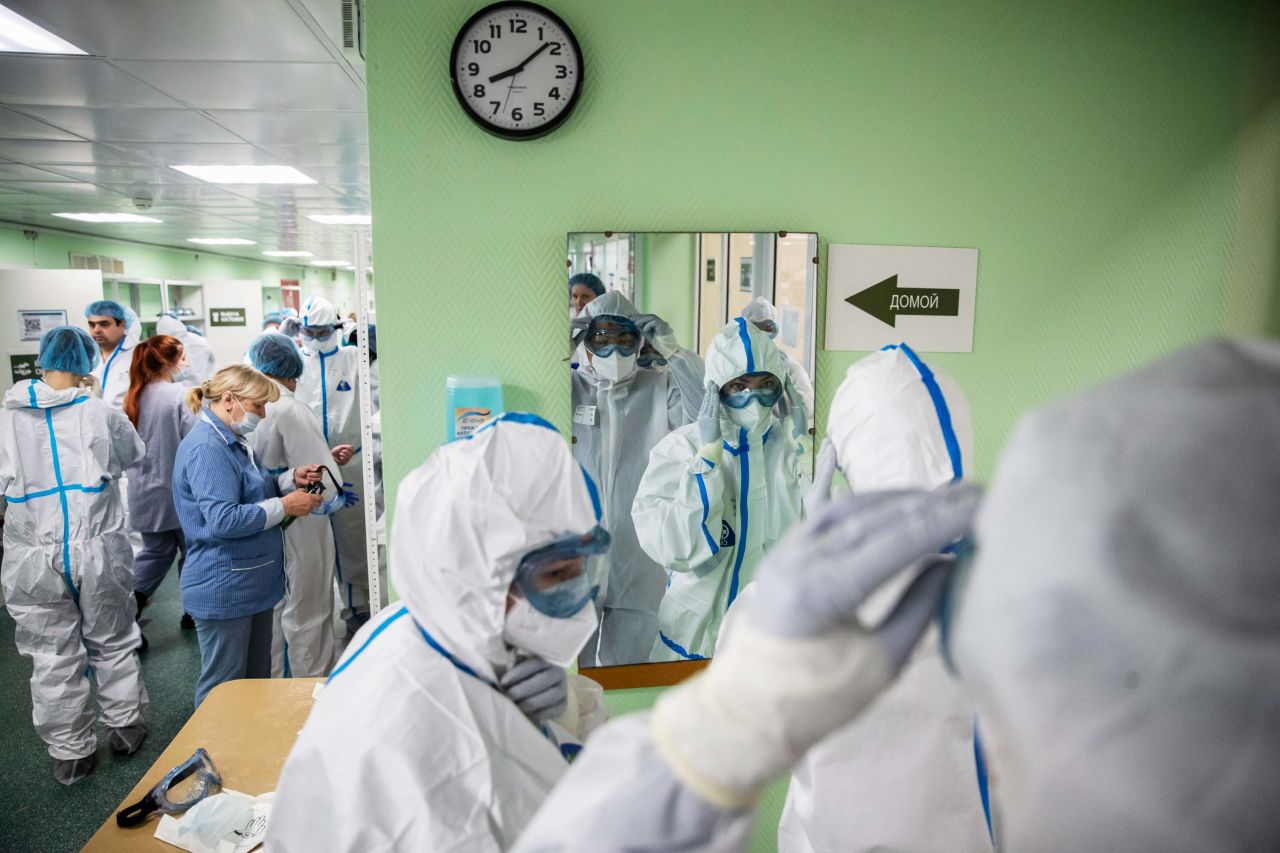 Medical workers put on protective gear before tending to coronavirus patients at the Filatov City Clinical Hospital in Moscow, Russia, on May 15.