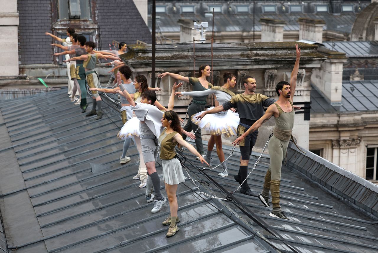 Dancers perform on a roof during the opening ceremony of the Paris Olympic Games.