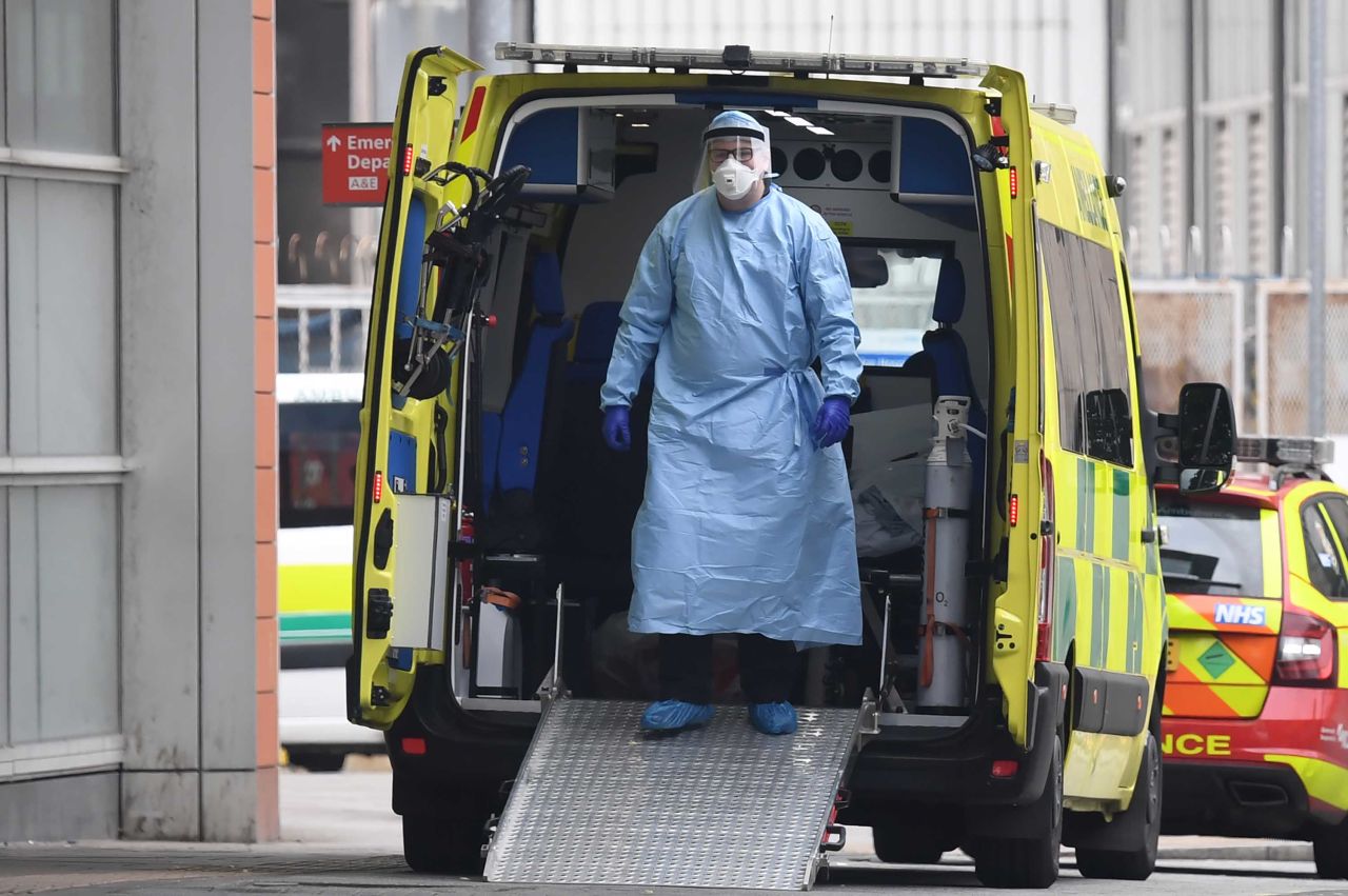 A health worker wears personal protective equipment in an ambulance after transferring a patient into The Royal London Hospital on April 18.