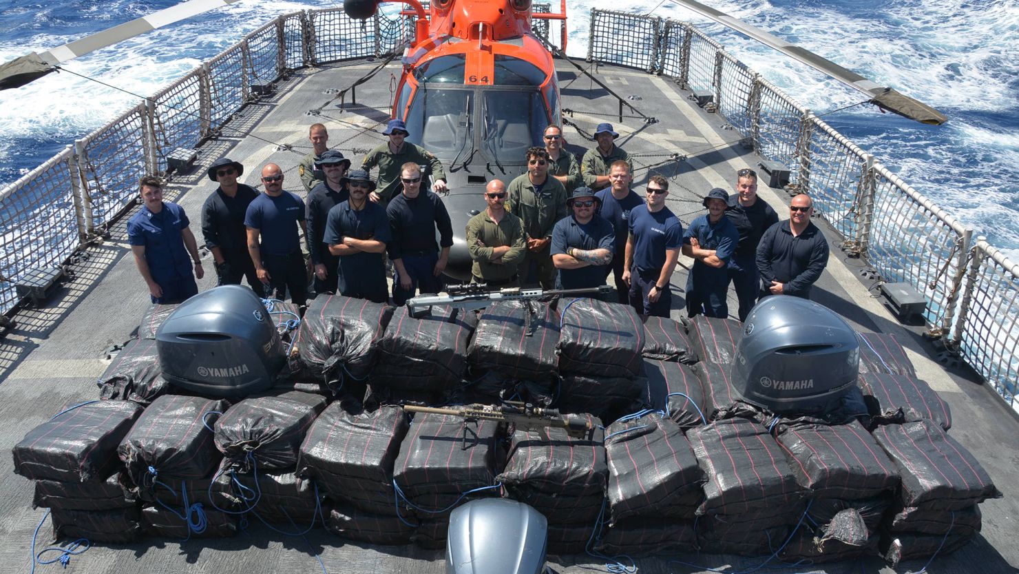 Crewmembers of the Coast Guard Cutter Alert (WMEC 630) stand behind cocaine bales seized from a drug smuggling vessel in Eastern Pacific waters during the cutterâ€™s last patrol out of its current homeport of Astoria,
Oregon, Feb. 7, 2024. The 4,950 kg of cocaine seized is estimated to be valued at more than $143 million. (U.S. Coast Guard courtesy photo)