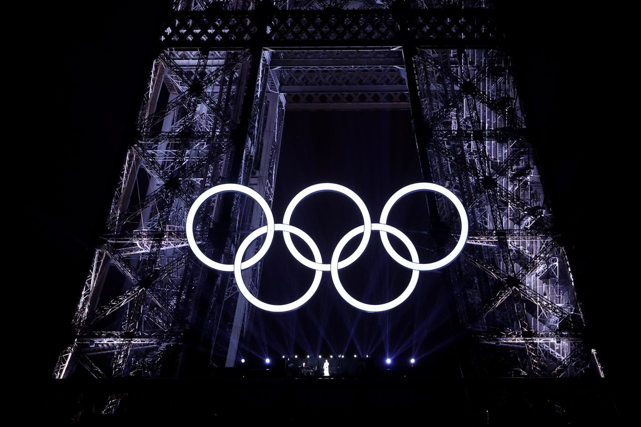 Celine Dion performs on the Eiffel Tower as the conclusion of the opening ceremony.