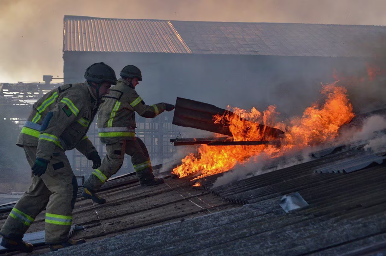 Emergency units carry out rescue tasks following Russian army shelling against the Ukrainian region of Kherson on September 28.