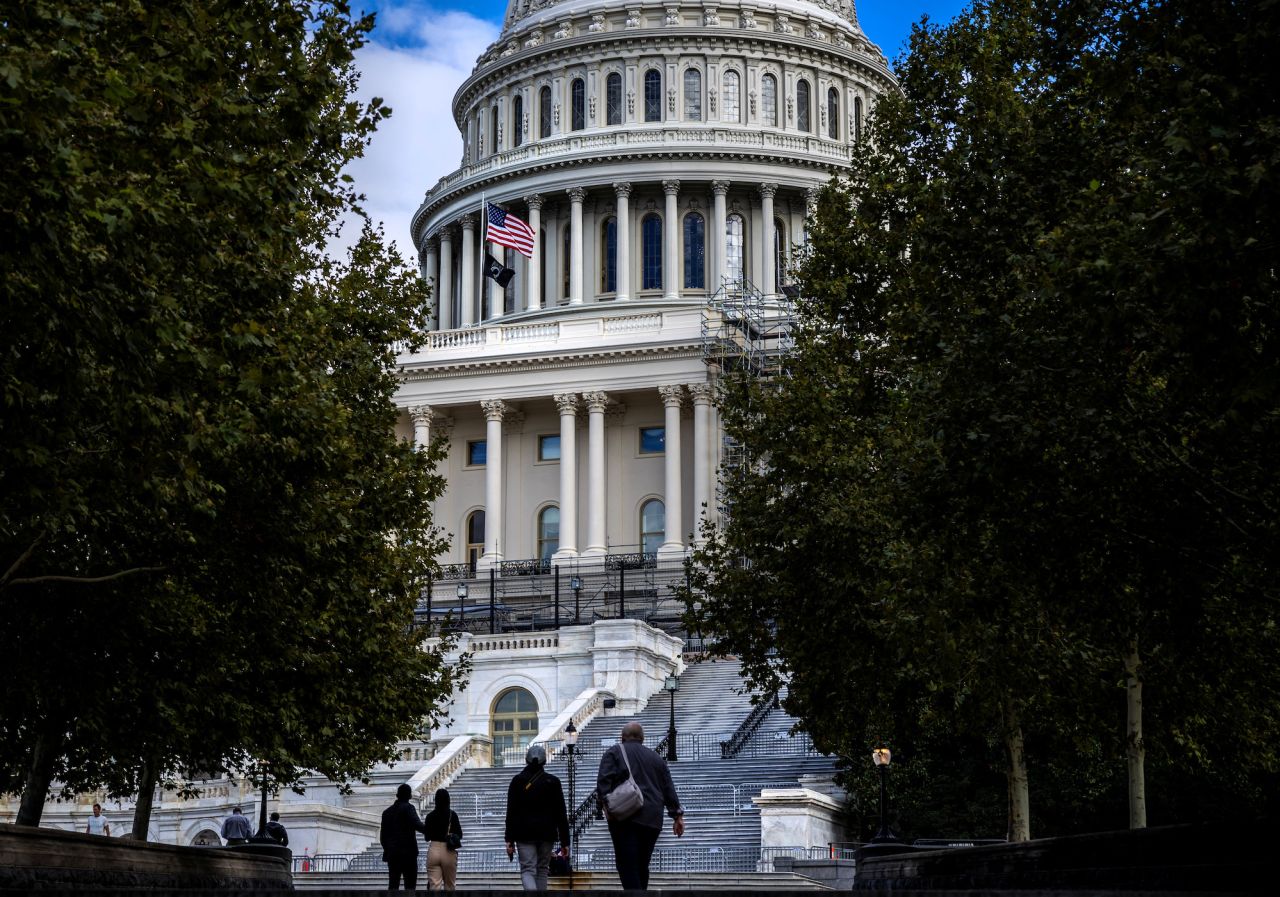 People walk outside the Capitol building on October 16.