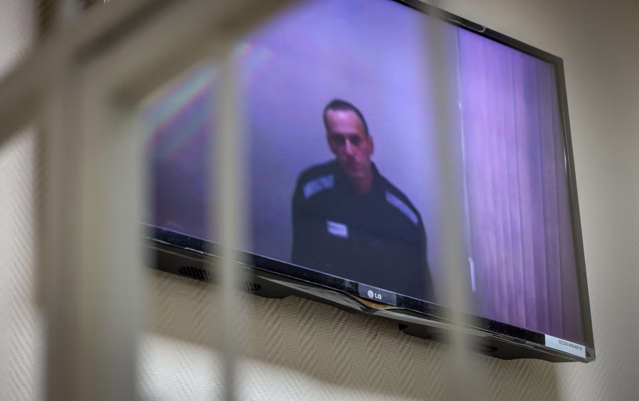 Jailed Kremlin critic Alexei Navalny appears on screen via a video link from prison during a court hearing on May 26, 2021.