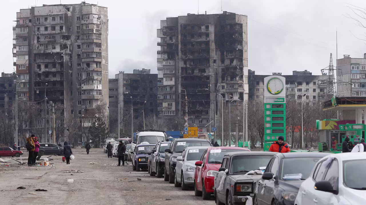 Several cars line up filled with evacuees as they prepare to leave the besieged city of Mariupol, Ukraine March 17.