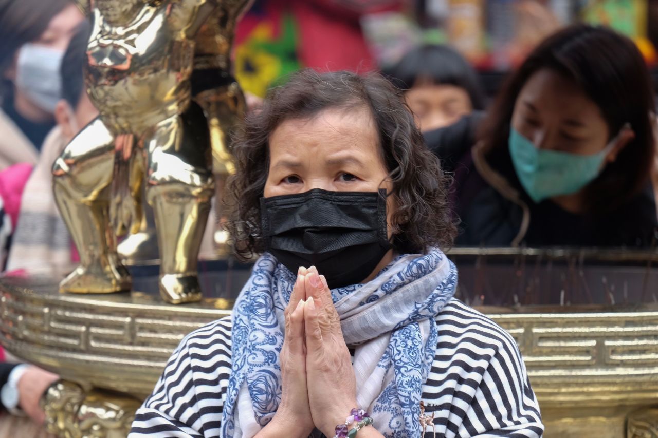 A woman prays at the Lungshan Temple in Taipei, Taiwan, on January 28, 2020.