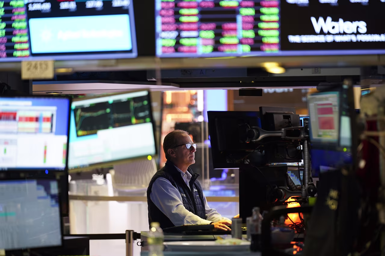 Traders work on the floor at the New York Stock Exchange on July 26.