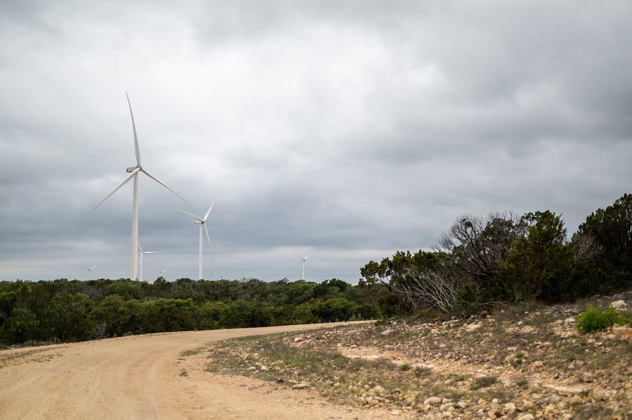 Wind turbines rotate in a field in Eldorado, Texas.