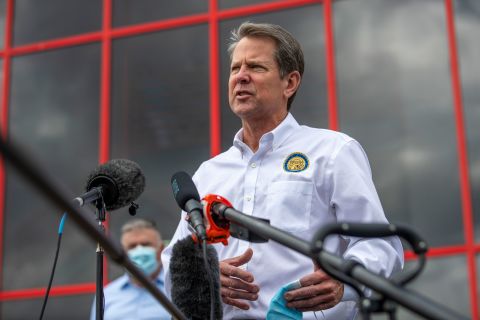 Georgia Gov. Brian Kemp makes a statement and answers questions from the media following a tour of Fieldale Farms while visiting Gainesville, Georgia, on Friday, May 15.