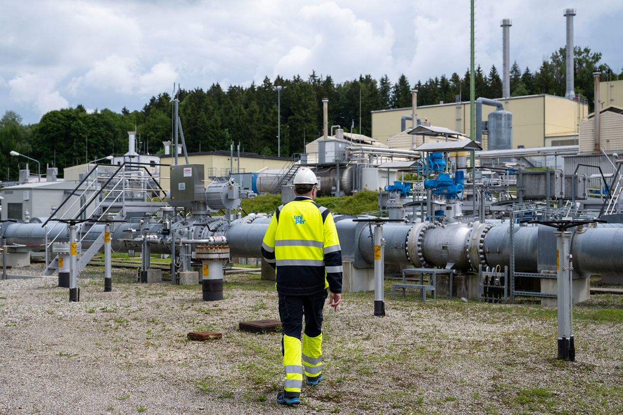 An worker walks through the above-ground facilities of a natural gas storage facility?at the Uniper Energy Storage facility in Bierwang, Germany, on June 10.