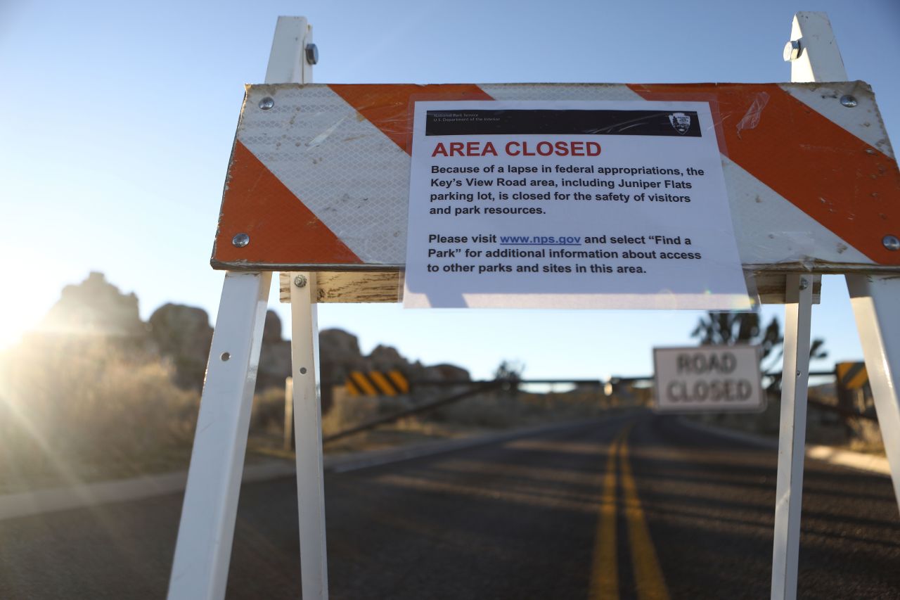 An 'Area Closed' sign is posted in front of a closed section of road at Joshua Tree National Park on Jan. 4 