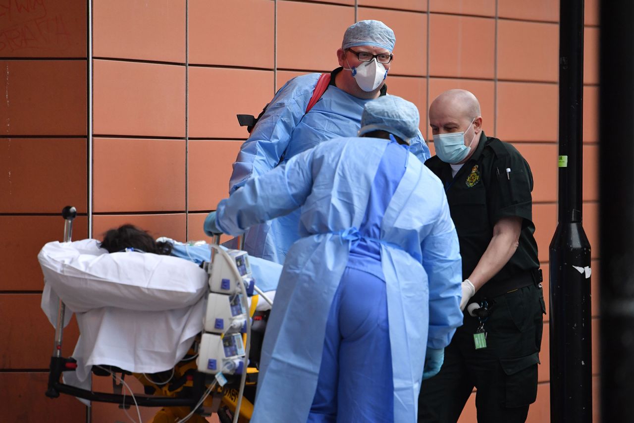 Paramedics unload a patient from an ambulance outside the Royal London Hospital in east London on January 8,.