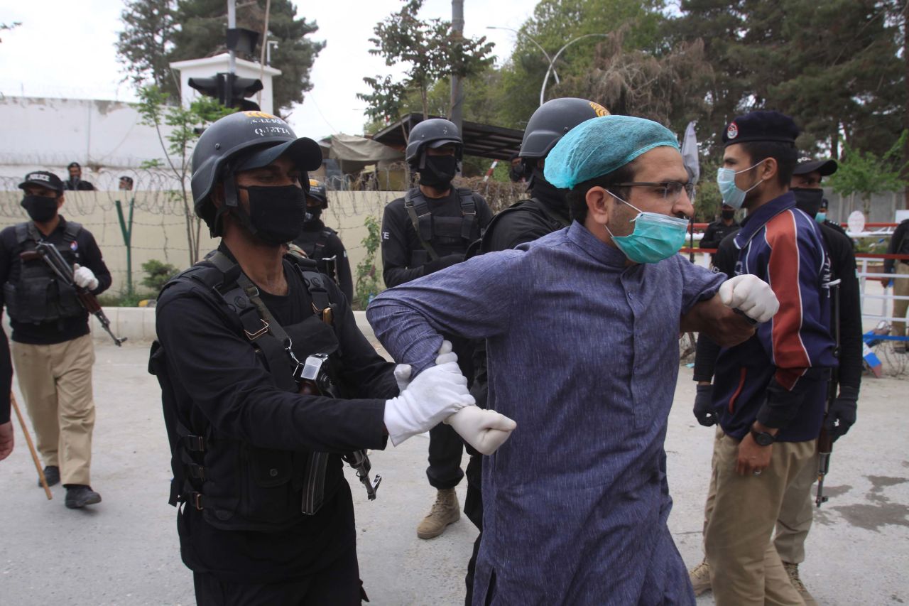 Police detain medical personnel demanding better facilities and personal protective equipment while caring for coronavirus patients in Quetta, Pakistan, on April 6.