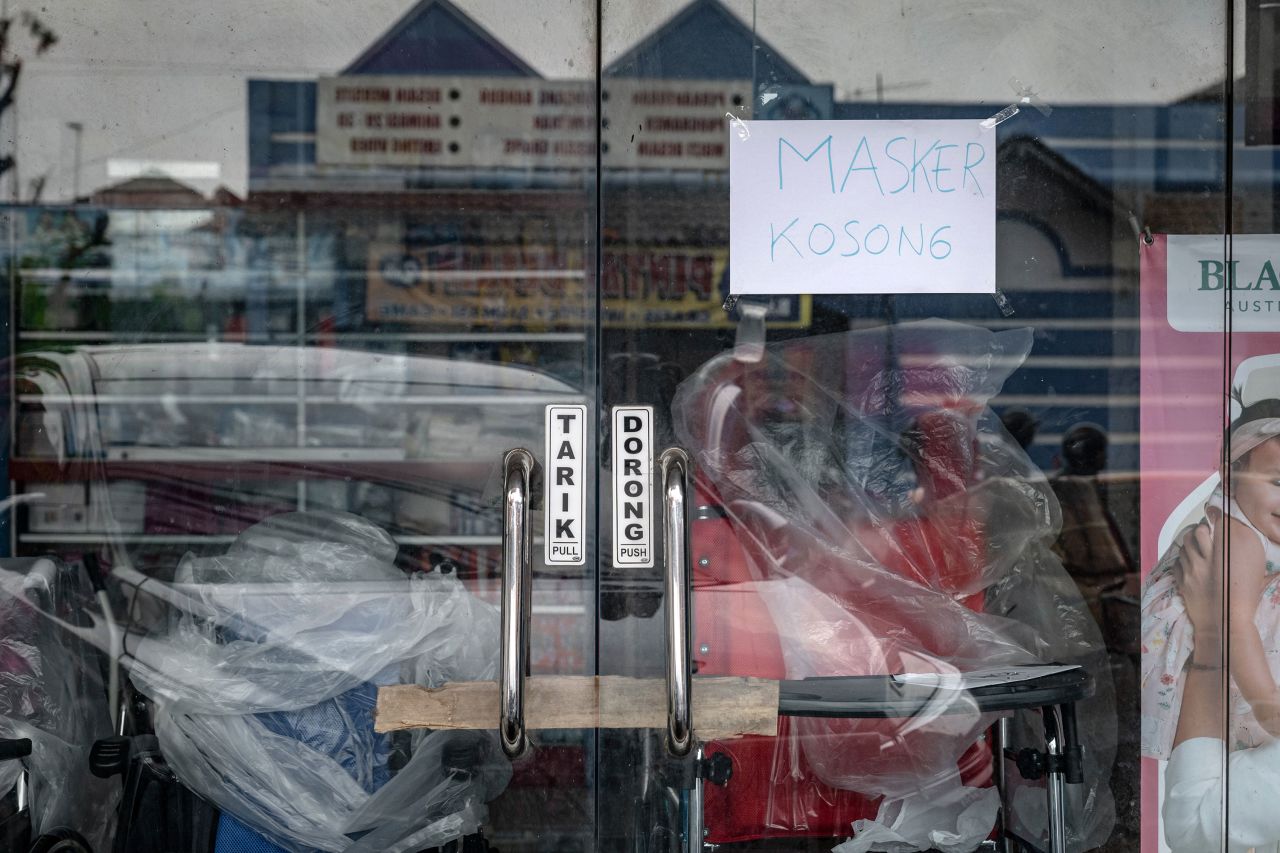 A sign announcing that masks are sold out is seen at a pharmacy in Yogyakarta, Indonesia on March 3.