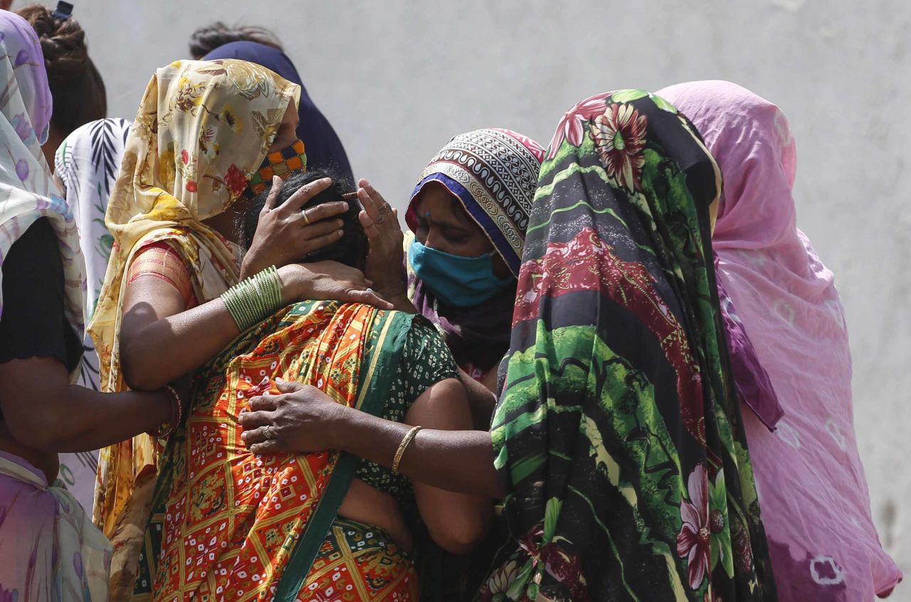 Relatives of a patient who died of Covid-19 mourn outside a hospital in Ahmedabad, India, on April 17. 