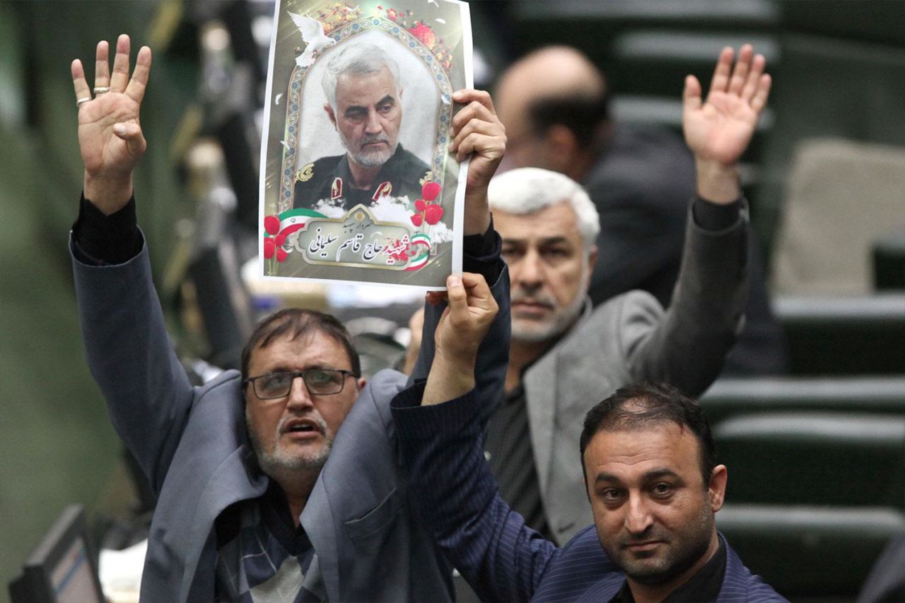 Lawmakers hold a picture of Qasem Soleimani inside parliament. Credit: Handout/ICANA/AFP via Getty Images